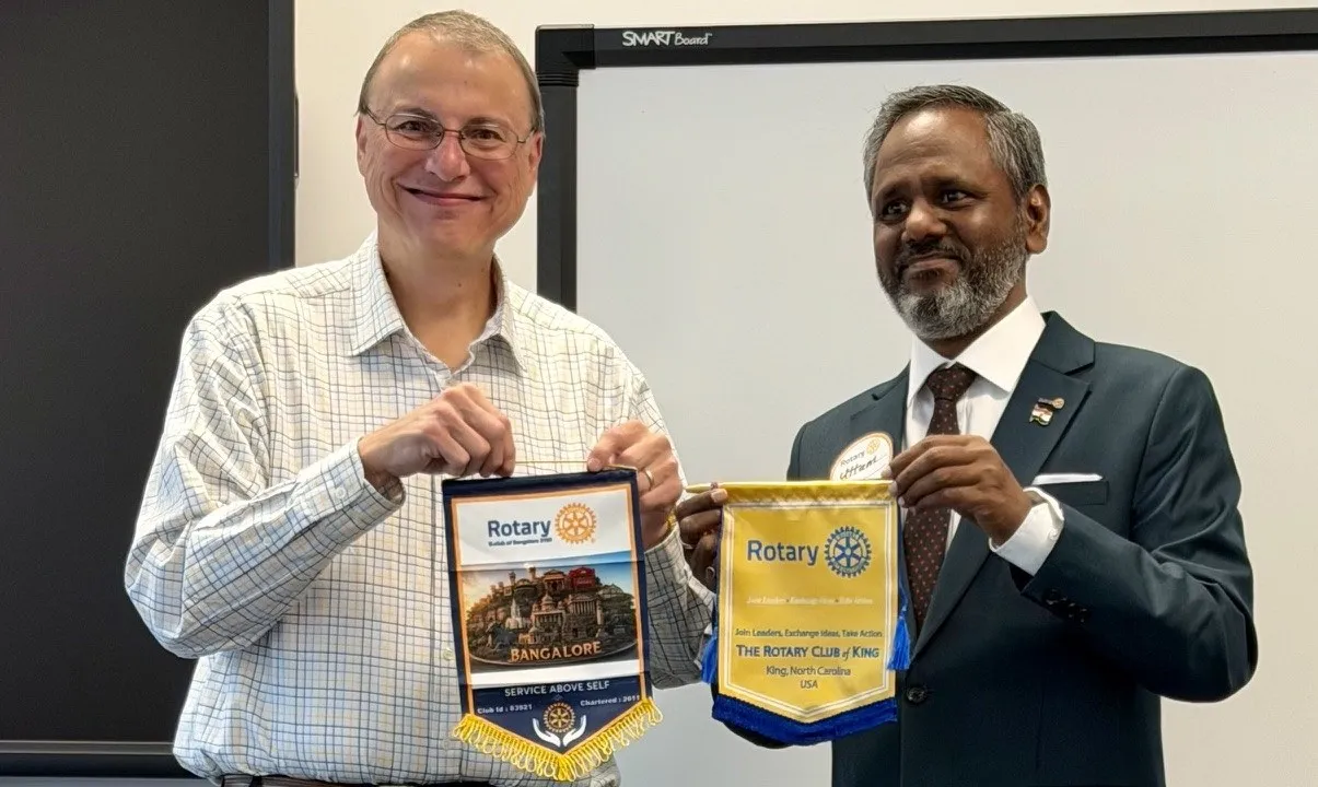 Flag exchange with the Rotary Club of King