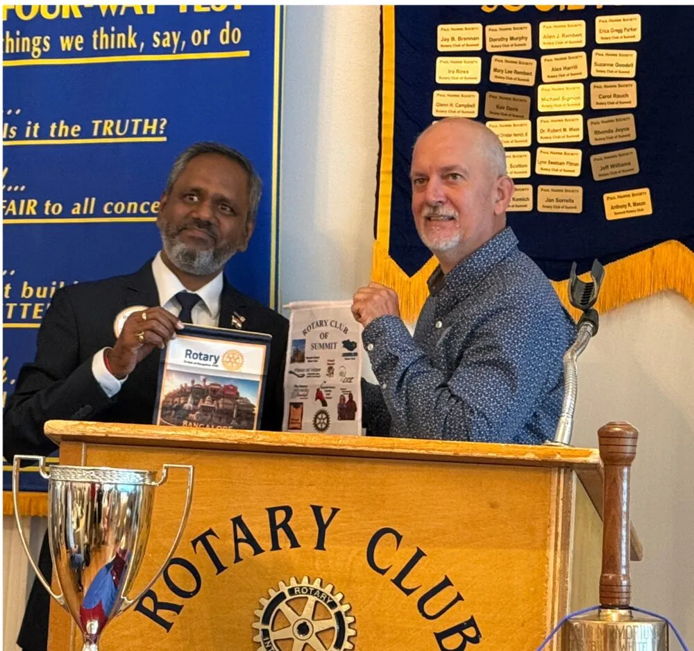 Flag exchange with the Summit Rotary Club